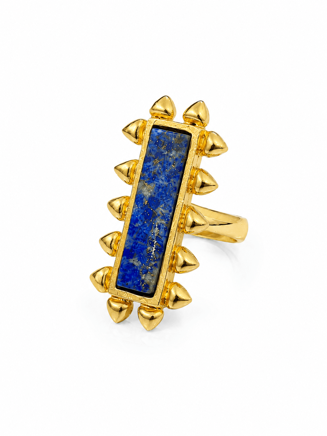 Close-up of AZRAQ ring showing its elongated blue lapis stone, gold-tone heart-stud edging and band on white.