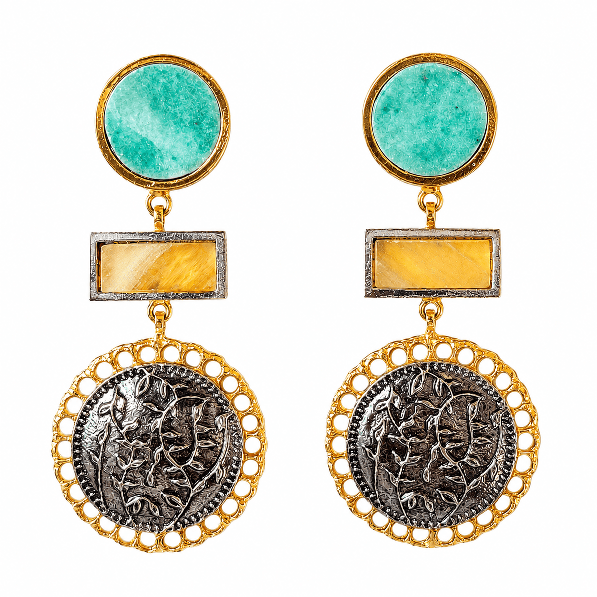 Close-up of ROYA earrings showing blue and yellow stones, gold-tone borders and dark floral-engraved circular drops on white.