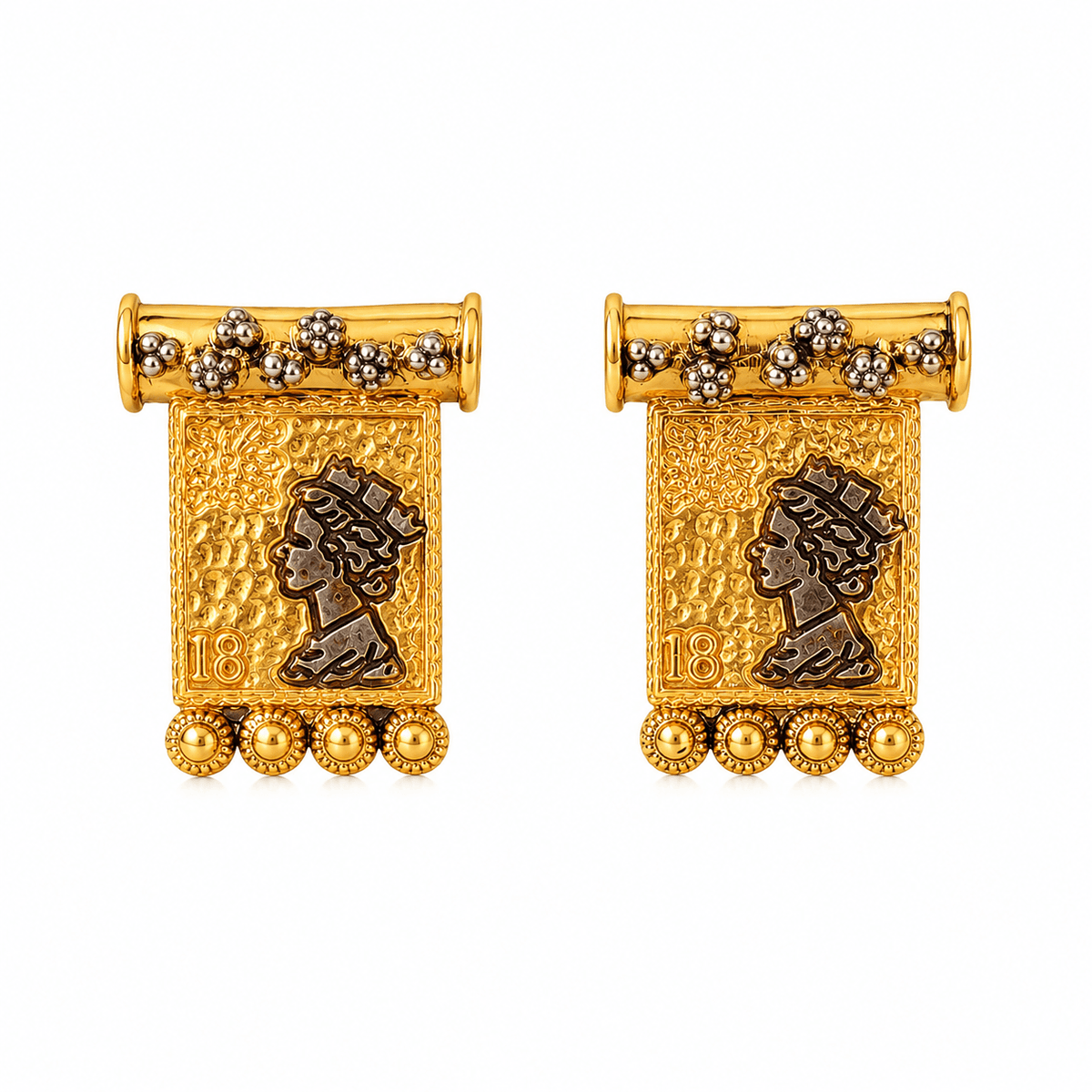 Close-up of TALA stamp-inspired earrings showing gold-tone texture, dark portrait motifs and floral details on white.